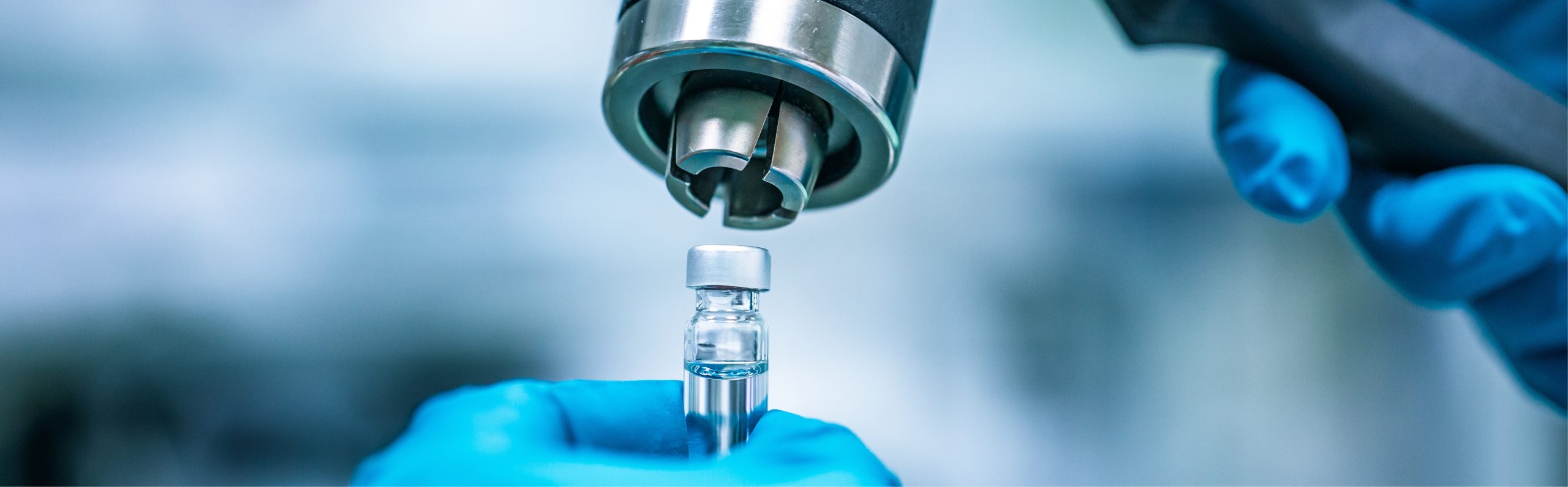 Production of a vial in a laboratory showcasing Good Manufacturing Practice (GMP) standards and quality assurance. Independent GMP auditing services and system implementation support for API manufacturers and contract medicinal product facilities.